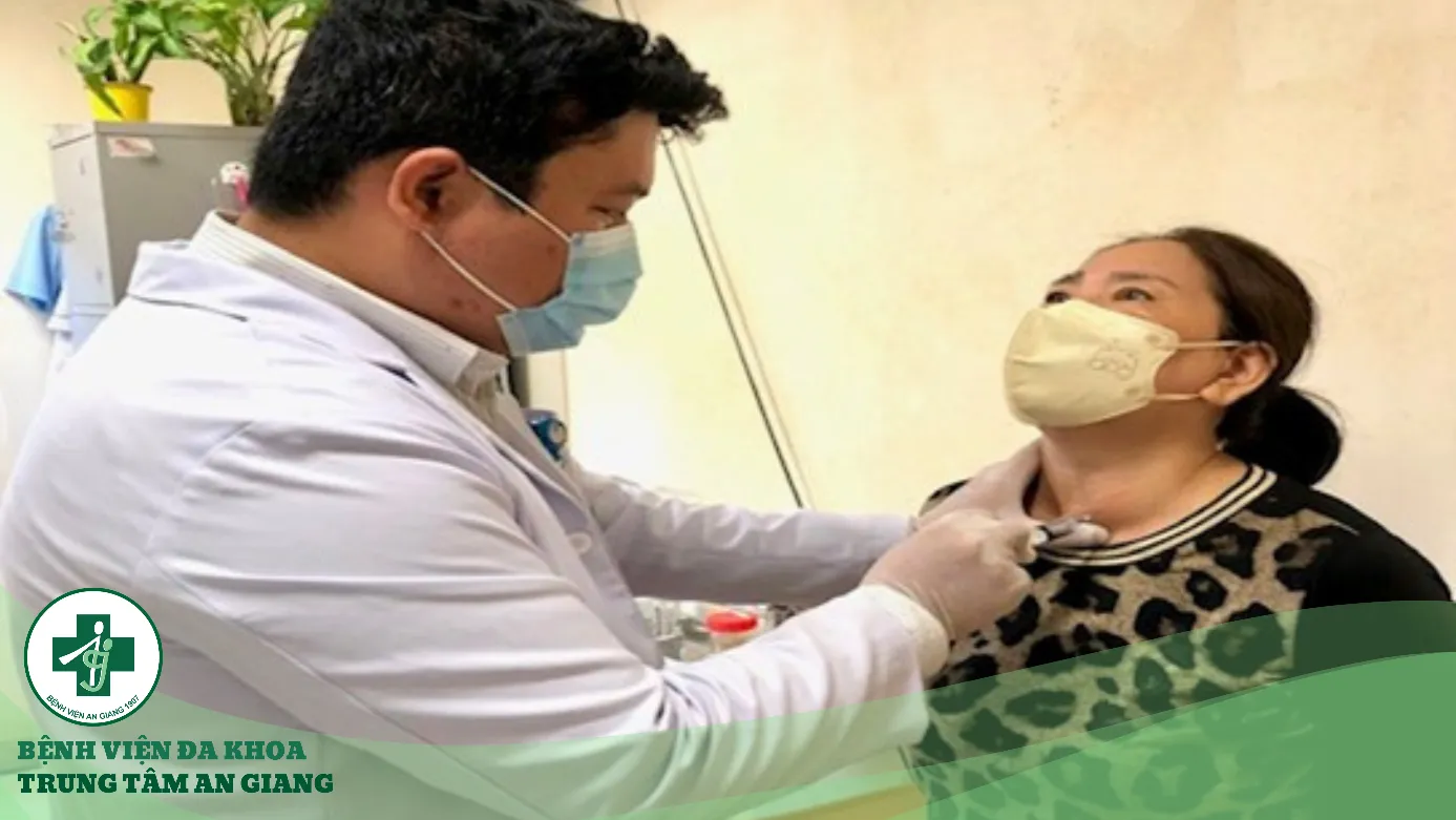 A doctor examining a patient Description automatically generated