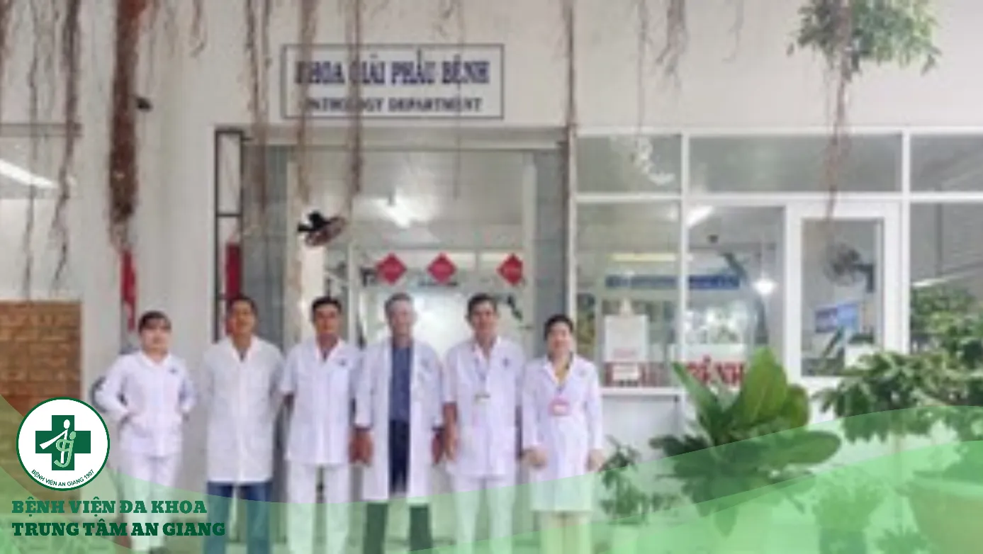 A group of men in white coats Description automatically generated
