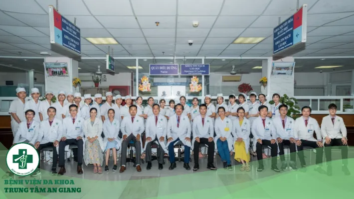 A group of people in white coats Description automatically generated