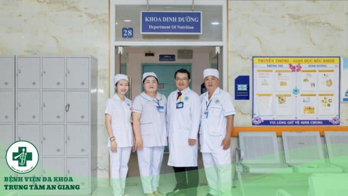 A group of people in white uniforms standing in front of a building Description automatically generated