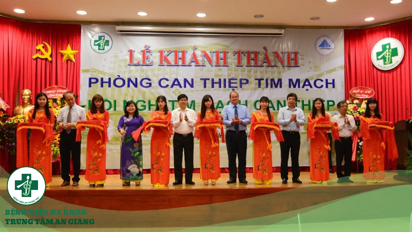 A group of people standing on a stage

Description automatically generated