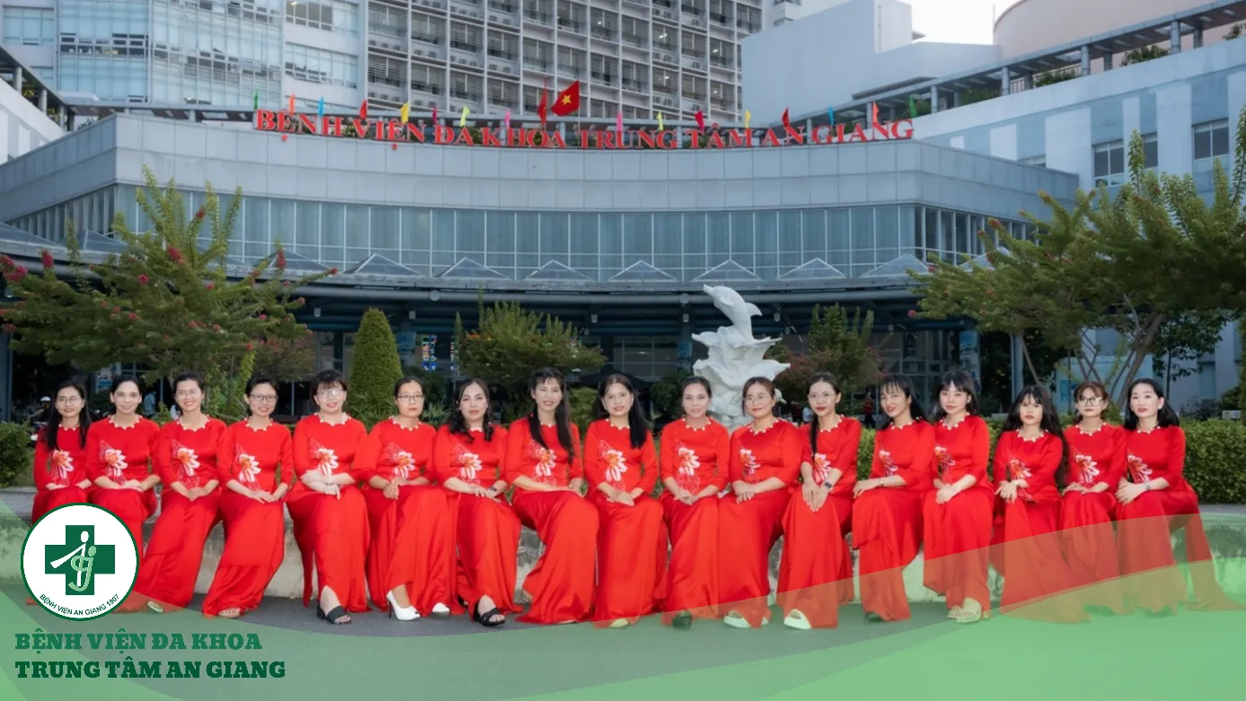 A group of women in red dresses posing for a photo

Description automatically generated