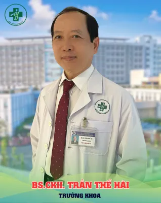 A person in a white coat Description automatically generated