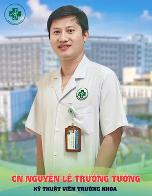 A person in a white coat Description automatically generated